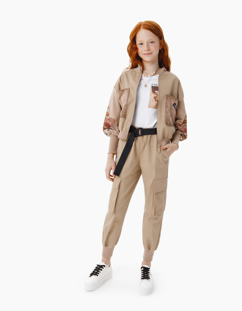 Купить светло-бежевые брюки бренда Bellbimbo для девочки