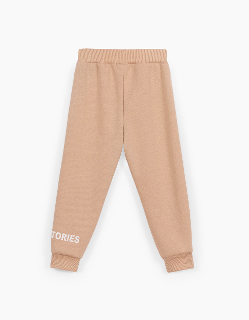 Бежевые брюки-джоггеры для девочки Бежевые брюки-джоггеры для девочки